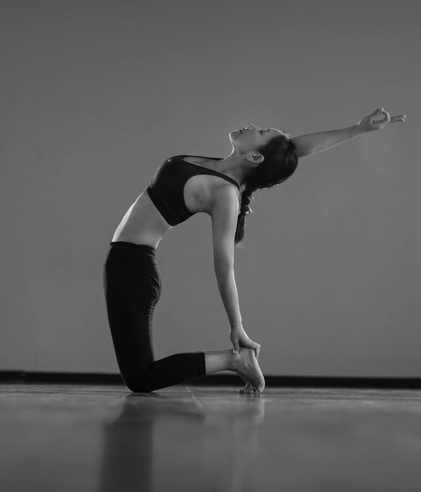 Woman in a calm yoga pose, symbolizing inner balance and strength.